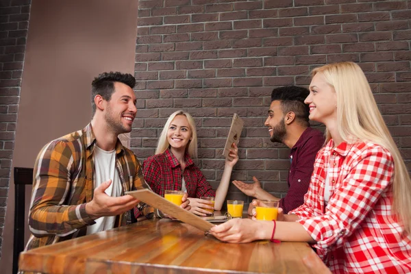 Young People Group Sit At Table Bar Hold Menu, Making Order, Mix Race man And Woman — Stockfoto