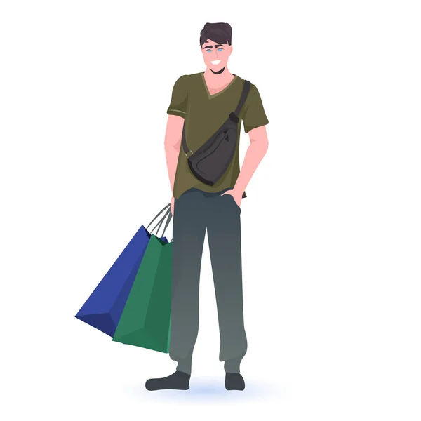 Muž drží nákupní tašky černé pátek velký prodej propagační sleva koncept — Stockový vektor
