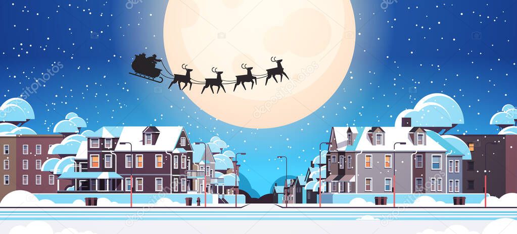 santa flying in sledge with reindeers in night sky over village houses happy new year merry christmas banner