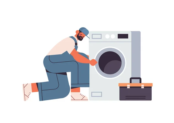 Técnico profissional encanador na reparação uniforme máquina de lavar roupa conceito de serviço de reparação —  Vetores de Stock