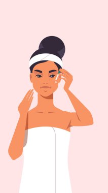 Havlu giymiş, temiz cilt bakımlı, göz damlası süren genç bir kadın. Yüz bakımı konsepti portresi.