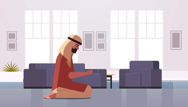 Religious muslim man kneeling and praying at home ramadan kareem holy month religion concept modern living room interior full length horizontal — Stock Vector