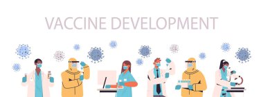 Coronavirüs araştırmacılarına karşı aşı geliştiren bilim adamları tıp laboratuarında çalışıyor.