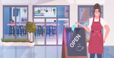 Garson maskesini çıkarıyor. Açık pano koronavirüs karantinasının yanında duruyor.