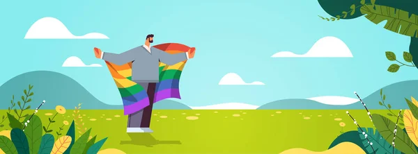 Homem segurando lgbt arco-íris bandeira gay lésbicas amor desfile orgulho festival transexual amor conceito — Vetor de Stock
