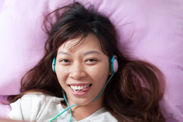 Asian girl showing tongue — Stock Photo, Image