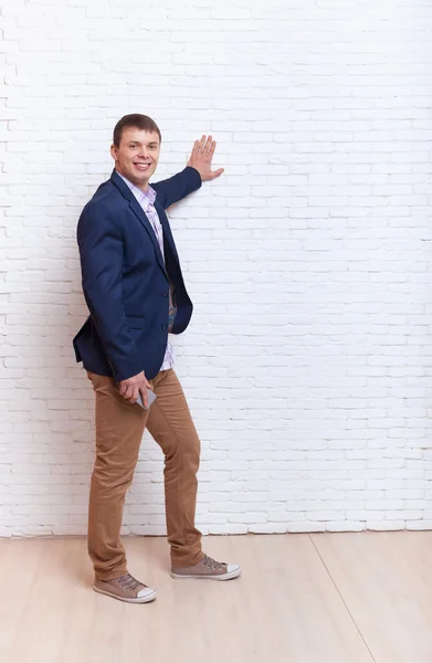 Young Man Hand On Wall Gesture To Copy Space Full Length — Stok Foto