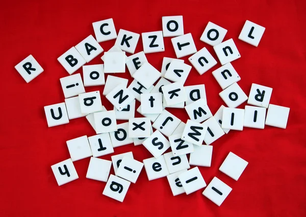 Letter tiles over red background — Stock Photo, Image