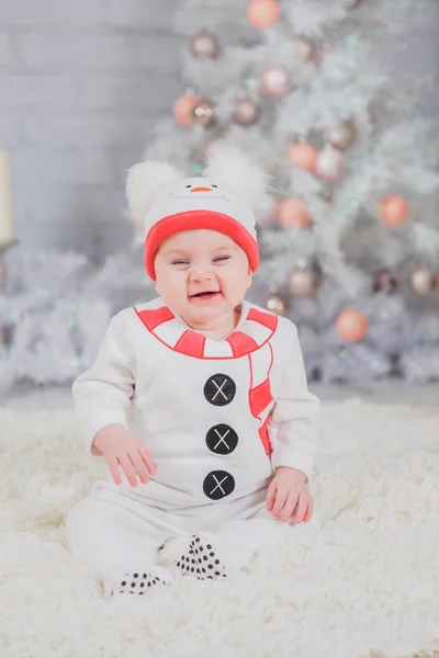 Kid in the costume of the snowman from white Christmas tree — Stock Photo, Image