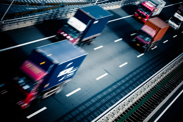 Motion trucks on the freeway — Stock Photo, Image