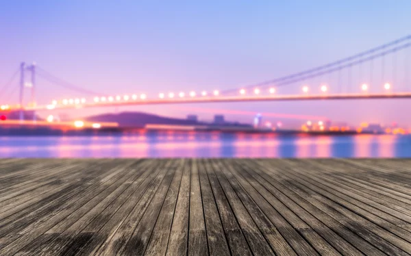 Blurred bridge lights and office buildings — Stock Photo, Image