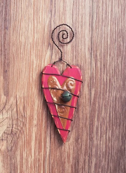 Christmas wooden decorations heart and christmas bell hanging on — Stock Photo, Image