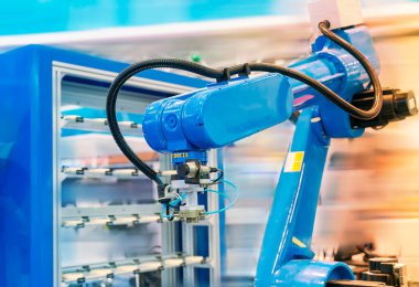 Otomatik kontrol uygulaması akıllı üretim arka planında otomatik robot kolu.