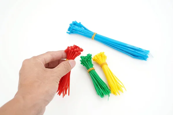 Mano Con Diferentes Colores Plástico Lazos Cable Nylon Primer Plano — Foto de Stock