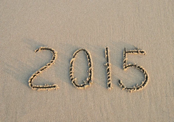 Ano 2014 mão escrita na areia — Fotografia de Stock