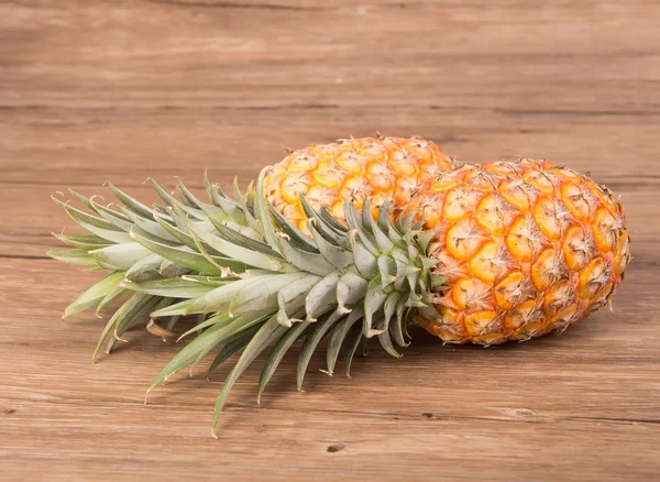 Pineapple on wooden grunge background — Stock Photo, Image