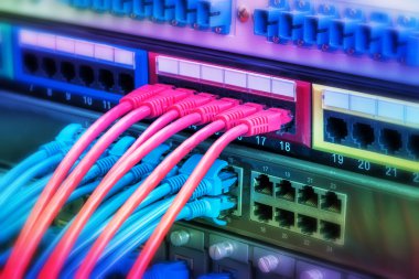 network cables and hub closeup with fiber optical background clipart