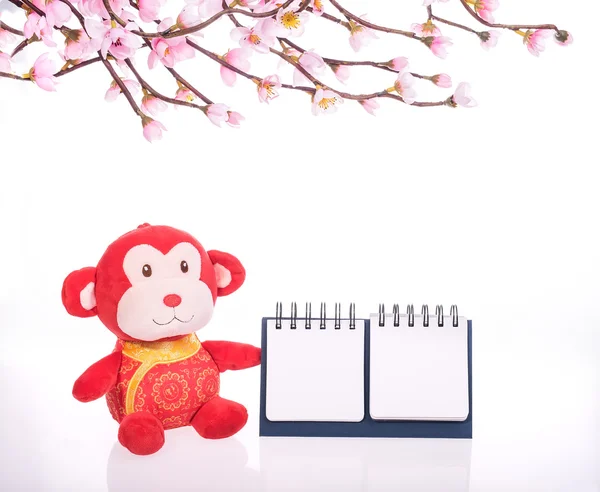 Chinese monkey toy  with blank calendar — Stock Photo, Image