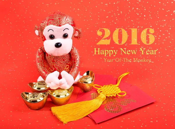 Chinese lunar new year ornaments toy of monkey on festive backgr — Stock Photo, Image