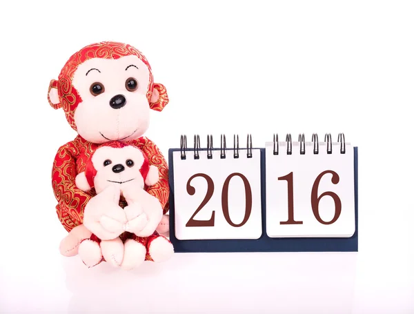 Kinesiska nyåret ornament leksak av apan på festliga bakgrunds — Stockfoto