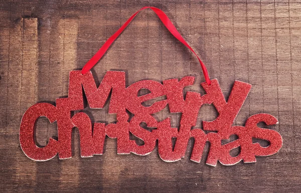 Merry Christmas written on wooden background — Stock Photo, Image