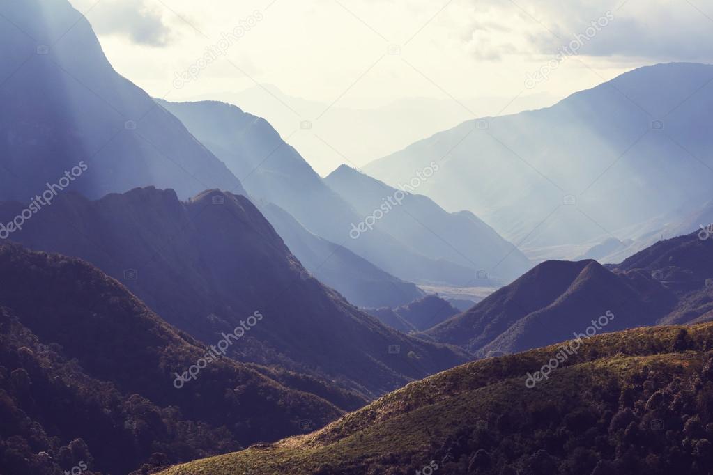 View of mountains with sun rays