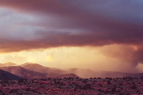 Rain in mountains at sunset — Stock Photo, Image