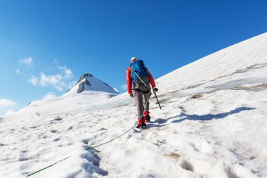 man climbing on mountain clipart