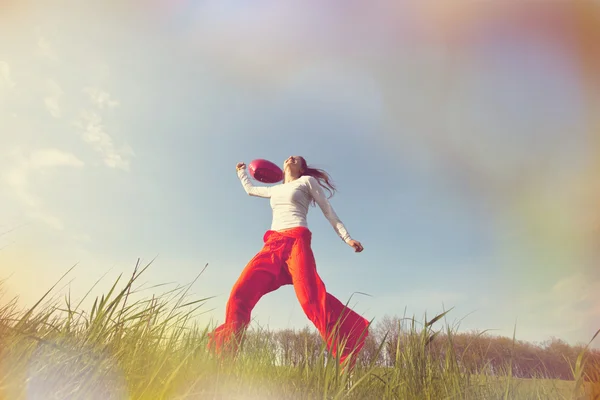 Happy girl on the grassland — Stock Photo, Image