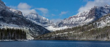 Scenic snow-covered peaks in winter in the Glacier National Park, Montana, USA. Instagram filter. clipart