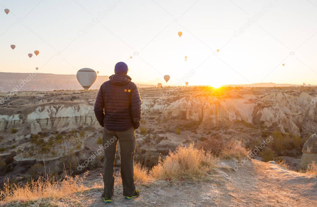 Colorful hot air balloons  in Goreme national park, Cappadocia, Turkey. Famous touristic attraction.