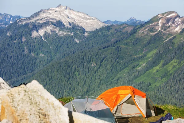 Hiking tent in the mountains in summer season