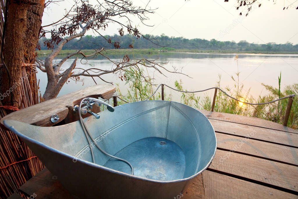 Luxury bathroom in riverbank outdoor, Africa