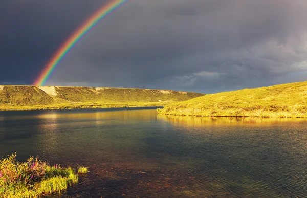 Colorful Rainbow above mountains — Stock Photo, Image