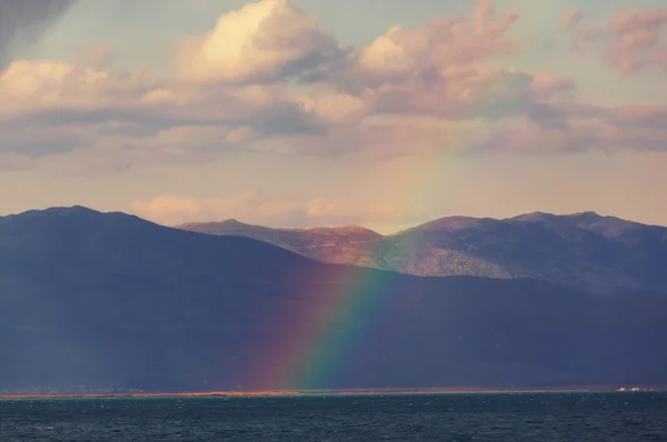 Rainbow above mountains — Stock Photo, Image