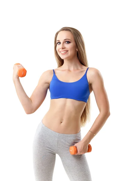 Beautiful fitness trainer working out with small dumbbells — Stock Photo, Image