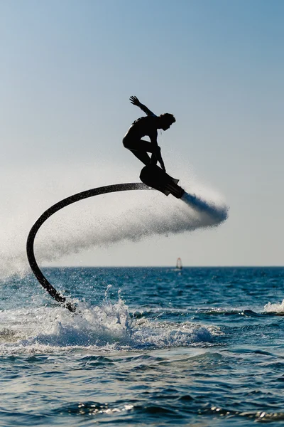 Silhouette di un hover board rider — Foto Stock