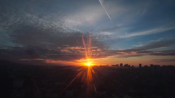 Travel: cityscape view at sunset through glass from moving cabin of ropeway. Handheld, slow motion 60fps. — Stock Video