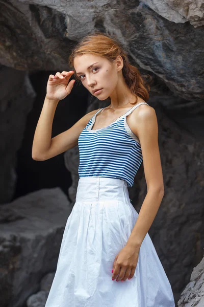 Young teen posing on stones at fashion photoshoot — Stock Photo, Image