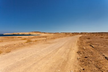 Desert road.  clipart