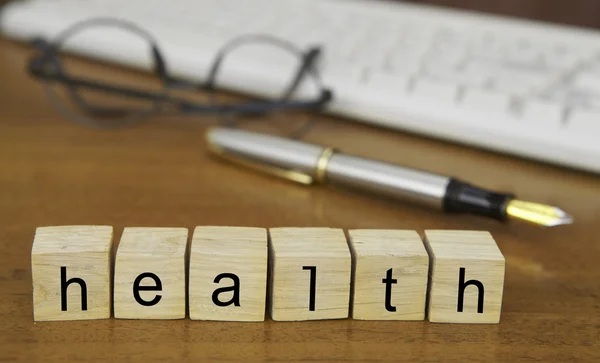 The word health on wood stamp — Stock Photo, Image