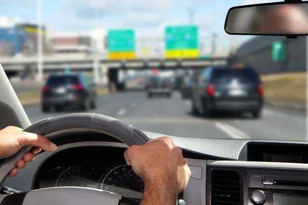 Man holding the steering wheel in a car — Stock Photo, Image