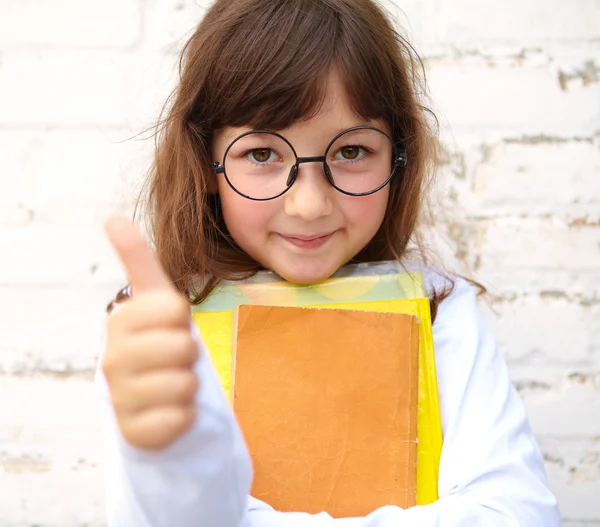 Little girl with glasses shows ok — Stock Photo, Image