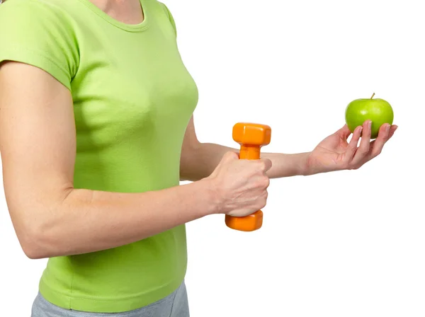 Woman with dumbbells and apple — Stock Photo, Image