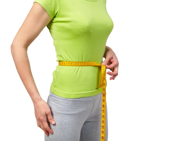 Mulher magra medindo sua cintura — Fotografia de Stock