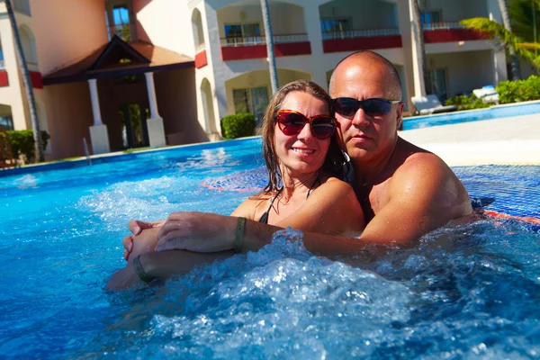 Loving couple in jacuzzi. — Stock Photo, Image