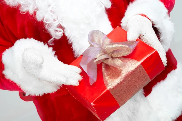 Hands of Santa Claus with gift — Stock Photo, Image