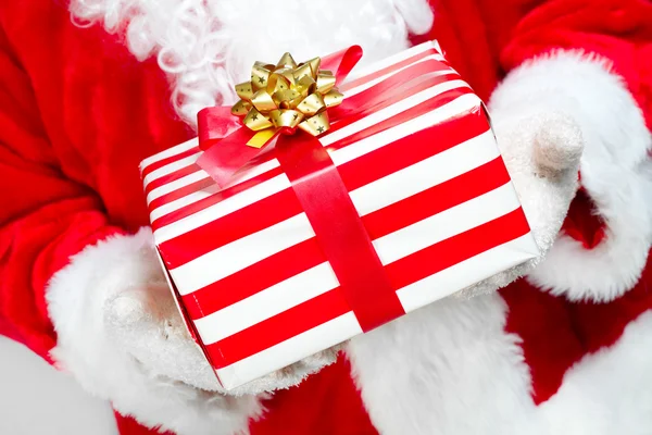 Hands of Santa Claus with gift — Stock Photo, Image