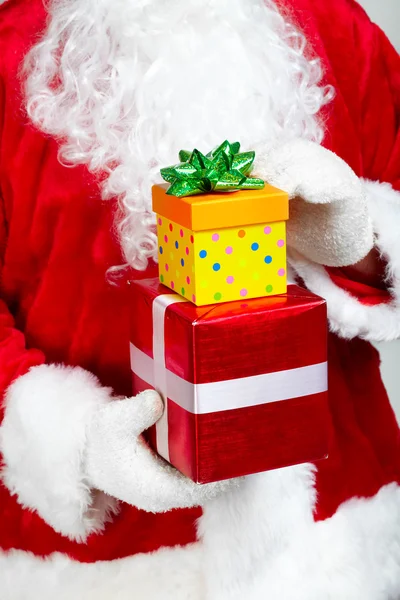 Hands of Santa Claus with gift — Stock Photo, Image