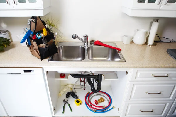 Plumbing tools on the kitchen. — Stock Photo, Image